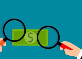 Money magnifying glass